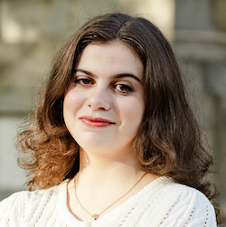 girl with brumette hair smiling