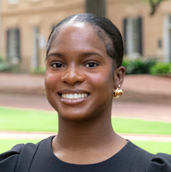 girl with hair pulled back smiling