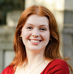girl with red hair smiling