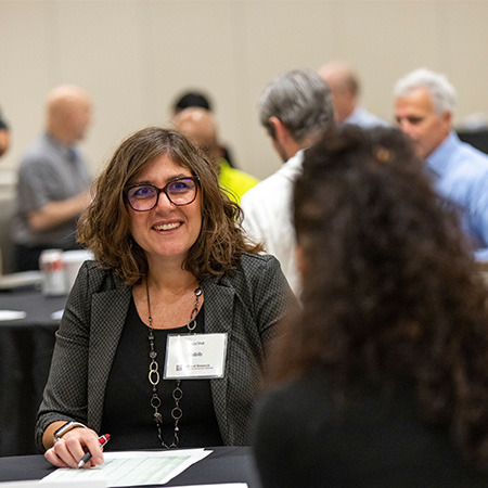 Sabrina Habib interacts with colleagues at the Propel AI kickoff.