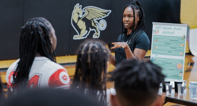 A USC student researcher leads a session on nutrition and hydration at Fairfield Middle School in August 2024.