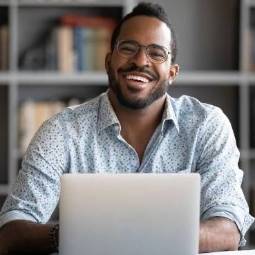 Online Degree Student working on his laptop