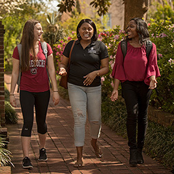 Three USC students walking on the horseshoe