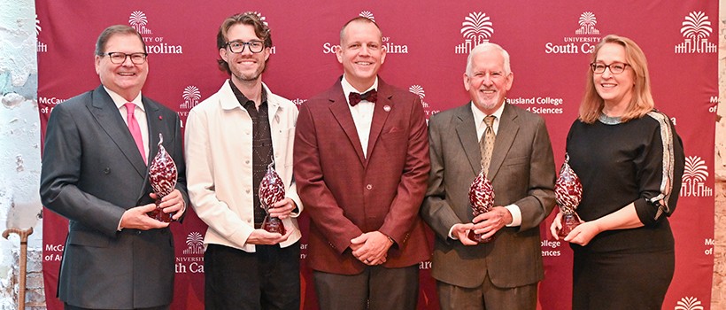 honorees smiling with the Dean at the ROE Awards