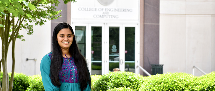 Fariha Mir stands in front of Swearingen building