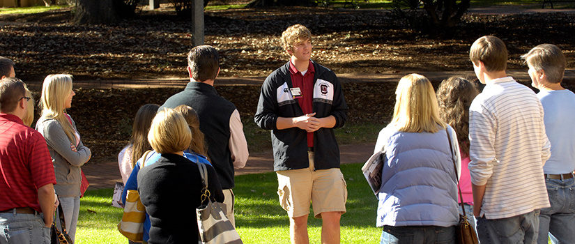 Nick Riley giving a campus tour as a student.