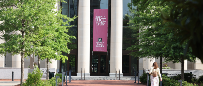 SC Rice Law Building with Employee walking in