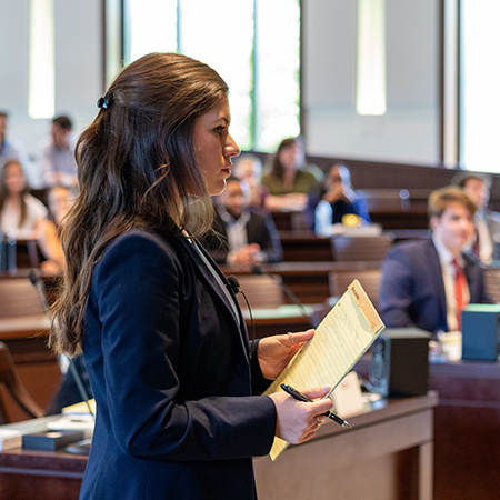 Female law student arguing during mock trial