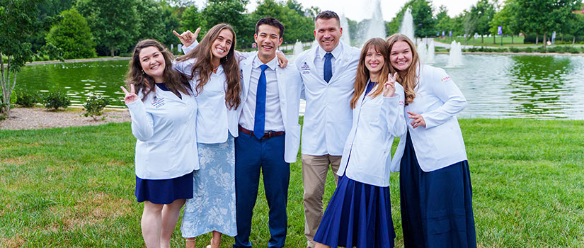 Class of 2029 with their white coats