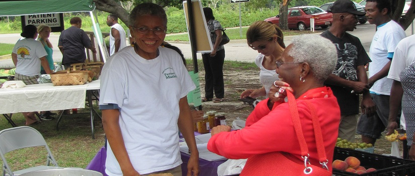 People smiling at a farmer's market