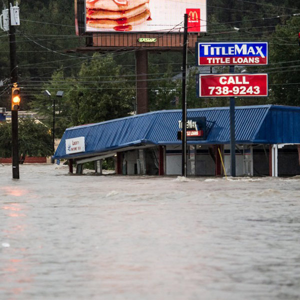 Flood waters in Columbia fill street and business
