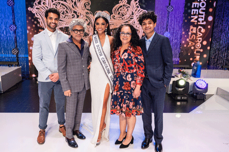 Meera Bhonslé stands onstage with family after winning Miss South Carolina USA