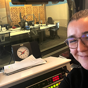 two people pose for a self-taken-picture in a recording studio