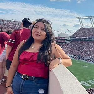 Laura Torres stands on the ramp overlooking Williams-Brice Stadium