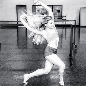 a girl dancing in a studio setting 